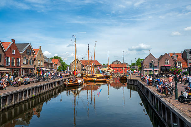 Bunschoten-Spakenburg, The Netherlands. May 31st, 2025: Scenic coastal view of the historic harbor in Bunschoten-Spakenburg, featuring traditional Dutch boats and a peaceful waterfront atmosphere. The old fishing village charm blends with maritime heritage, offering a glimpse into the Netherlands’ nautical past.
