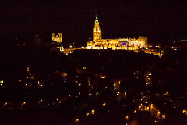 The Cathedral of Toledo, Spain, lit up at night, seen from the viewpoint of the Valley