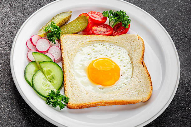 istock Fried gashouse eggs in bread egg in the basket delicious snack breakfast in a bowl fresh delicious gourmet food background on the table rustic food top view copy space 2217952704