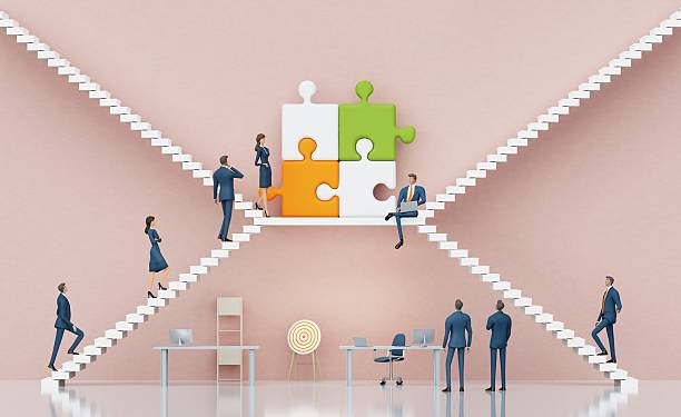 istock Business people working with puzzles, environment with stairs representing growth and ladder of success. 3D 2217954030
