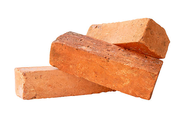 istock Side view of three cracked old red or orange bricks in stack isolated on white background with clipping path 2217955298