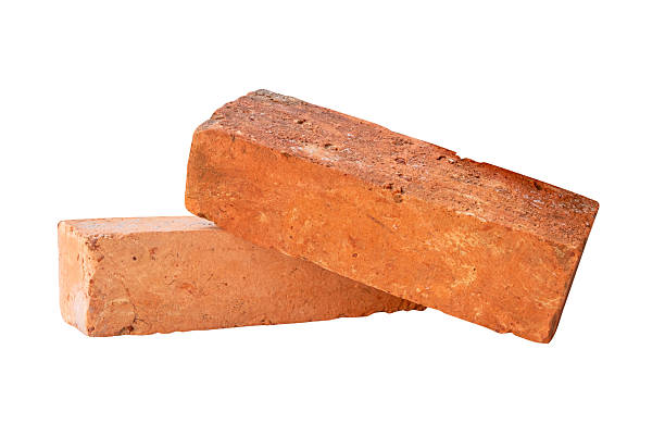 istock Side view of two cracked old red or orange bricks in stack isolated on white background with clipping path 2217955517
