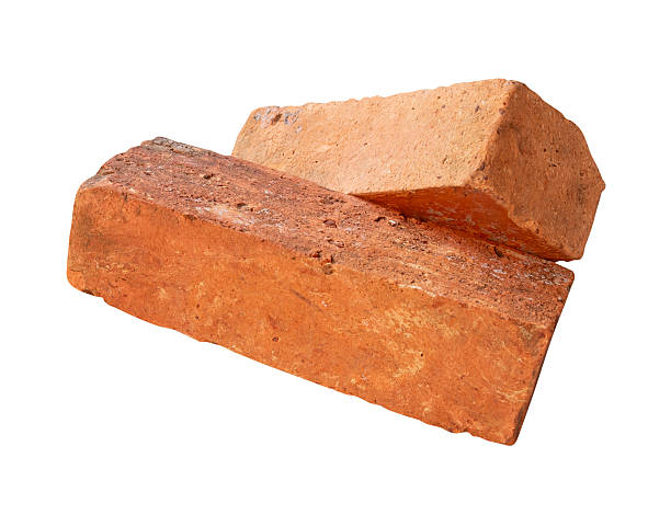 istock Side view of two cracked old red or orange bricks in stack isolated on white background with clipping path 2217955780