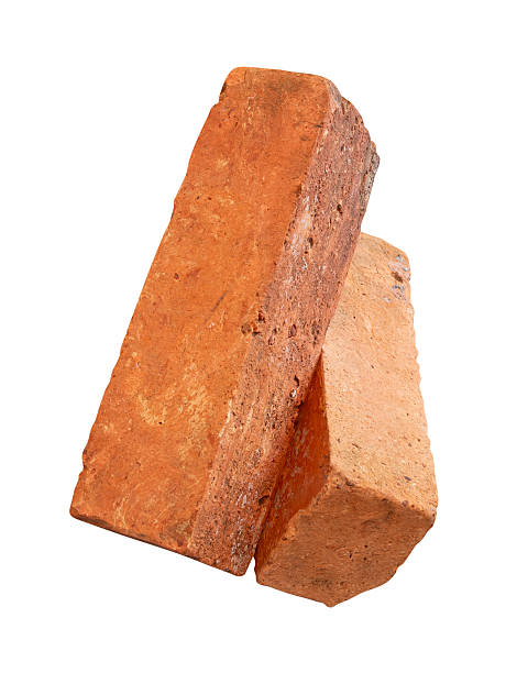 istock Side view of two cracked old red or orange bricks in stack isolated on white background with clipping path 2217955874