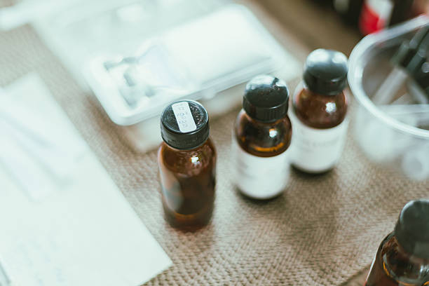 istock Shot of mature perfumer adding extra essential oil 2217956029
