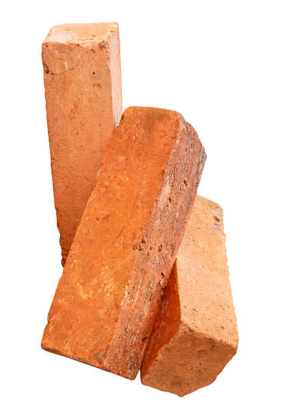 istock Side view of three cracked old red or orange bricks in stack isolated on white background with clipping path 2217956205
