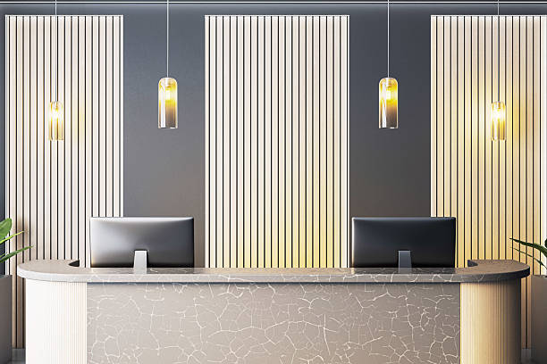 istock Modern luxury reception desk with lighting and wood panel wall in stylish office or hotel interior closeup view. 3D Rendering 2217957831