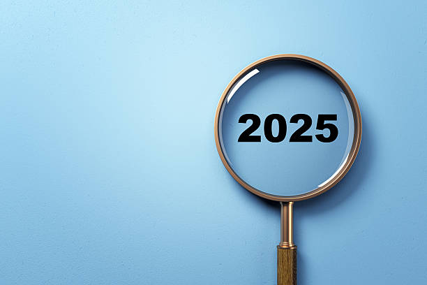 istock Magnifying glass highlighting number 2025 on blue gradient background, symbolizing future research, discovery, or business vision concept. 3D Rendering 2217957909