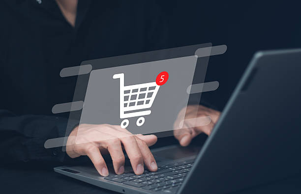 istock Online shopping and e-commerce technology internet concept. Woman or Shopper using a laptop computer with shopping cart icon, shopping service on the online web, Buy in online shop, 2217960419