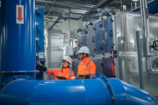 istock Engineer or worker inspection maintenance industrial facility system of operations HVAC (Heating, Ventilation, and Air Conditioning), chemical processing, or clean energy automated industrial settings. 2217961090