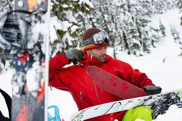 istock Backcountry splitboarder removes ski skin 2217961399
