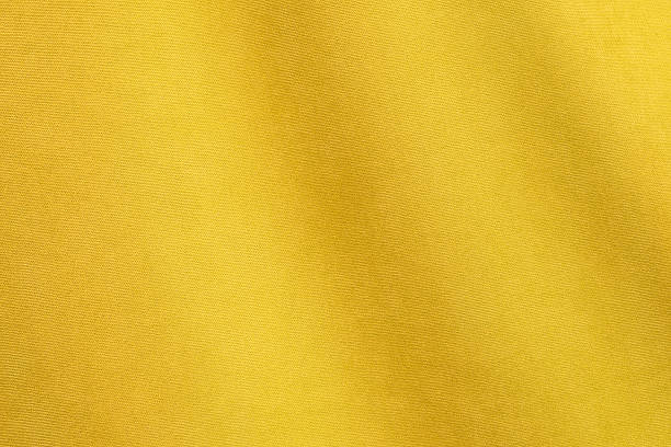 istock Gold shiny wall abstract background texture, Beatiful Luxury and Elegant. Yellow background cloth fabric orange color gradient texture pattern silk wave banner gold, fashion material backdrop poster for summer tropical travel holidays,satin mockup premium 2217961964