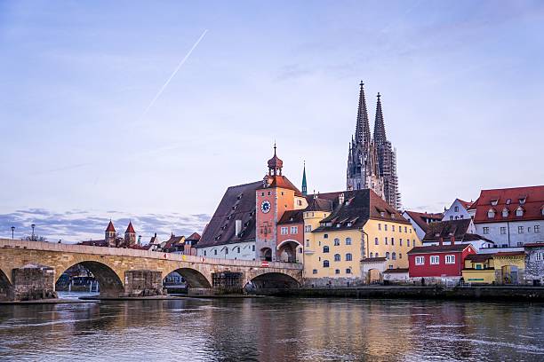 istock Regensburg's Stone Bridge and Cathedral at Dusk 2217962936
