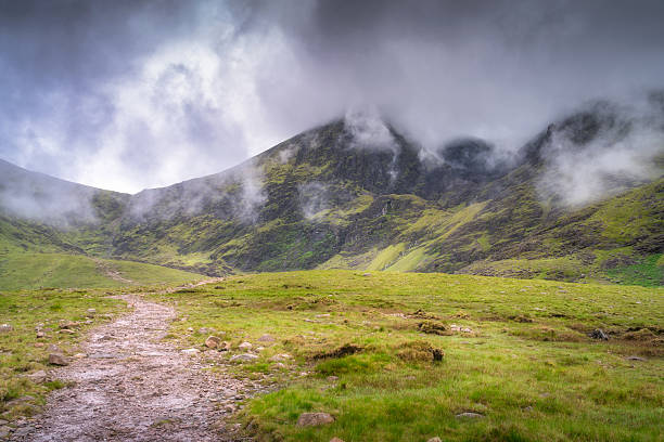 istock An incredibly serene mountain landscape enveloped in mystical mist, evoking a sense of adventure and peace 2217963877
