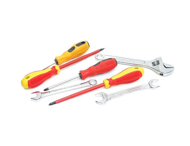 istock Tools equipment, wrenches, screwdrivers, yellow and red handles with black stripes placed on a white background. 2217965228