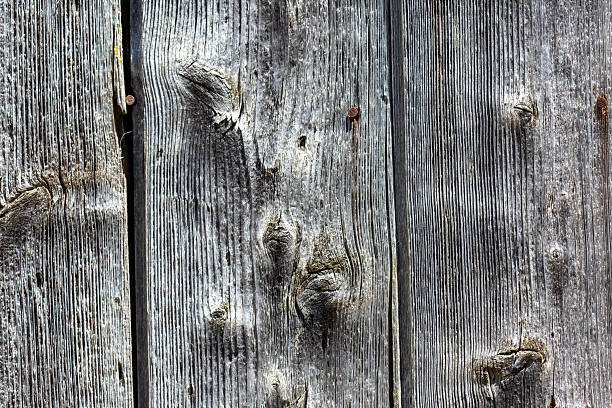 istock Weathered Grey Wooden Planks with Rusty Nails 2217967592