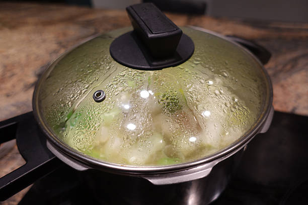 istock Cooking in progress with a pressure cooker 2217971420