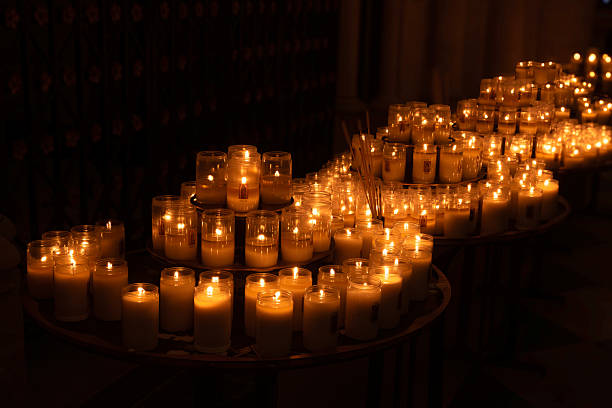 istock Candlelight glowing votive candles flicker gently on wooden tables. 2217972002