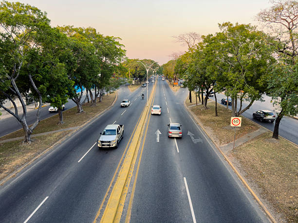 Bogotá, Colombia - August 02, 2025: The driver's point of view on the  Bogotá-Villeta Highway to Subachoque, just leaving the capital city. The road leads to La Cuesta and the branch-off to Subachoque. On view on either side of the highway is the Sabana de Bogotá, part of the Altiplano Cundiboyacense (the high plateau of Cundiboyacense), and the countryside outside Bogotá. The altitude at road level is around 8,500 feet above mean sea level. Horizontal format. Copy space.