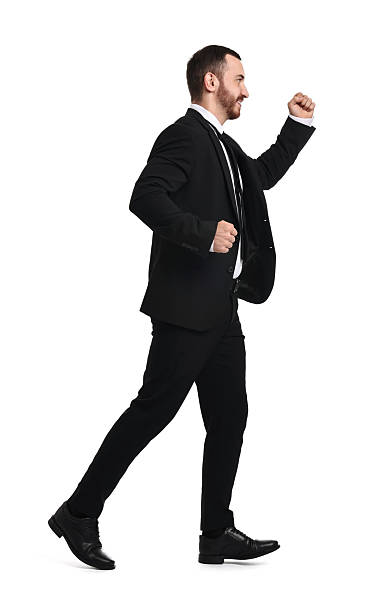 istock Young businessman in suit running on white background 2217981636