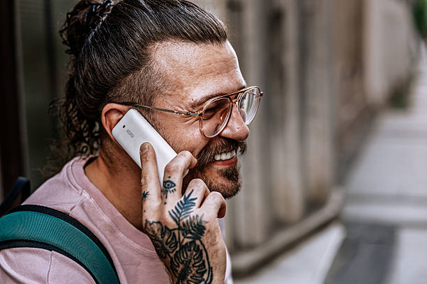 istock rendy Hipster Using retro tech Phone in City – Retro Tech Meets Modern Style 2217982193
