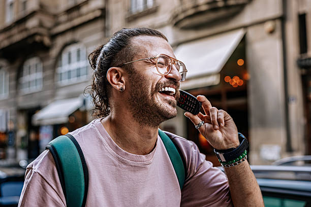 istock rendy Hipster Using retro tech Phone in City – Retro Tech Meets Modern Style 2217983081