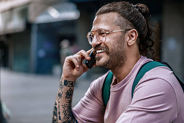 istock rendy Hipster Using retro tech Phone in City – Retro Tech Meets Modern Style 2217983123