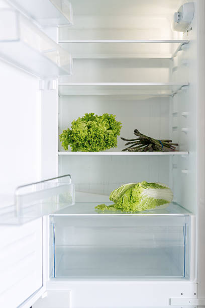 istock Fresh vegetables stored in a modern open fridge showcasing a clean design 2217984817