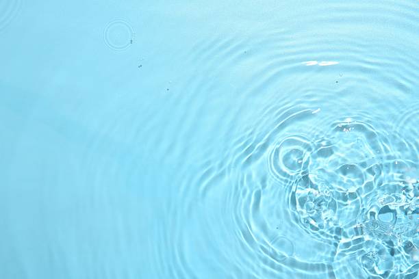 istock Rippled surface of clear water on light blue background, top view 2217988601