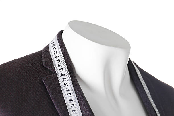 istock Mannequin with jacket and measuring tape isolated on white 2217989363