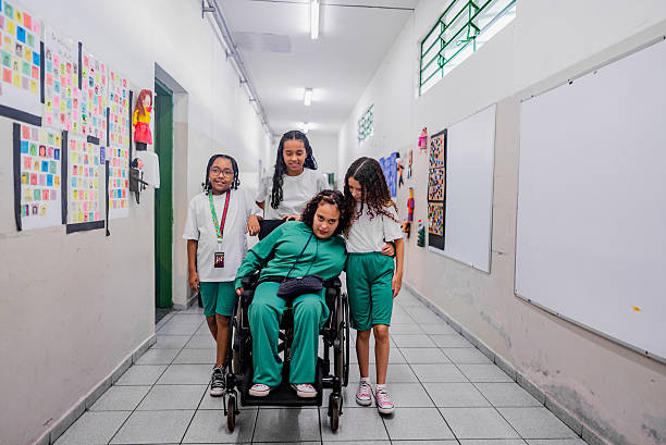 istock Schoolgirls talking and walking on school corridor 2217994878