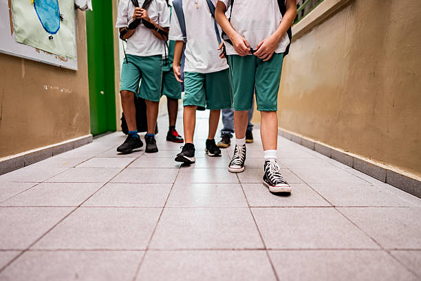 Schoolboys walking on the school hallway