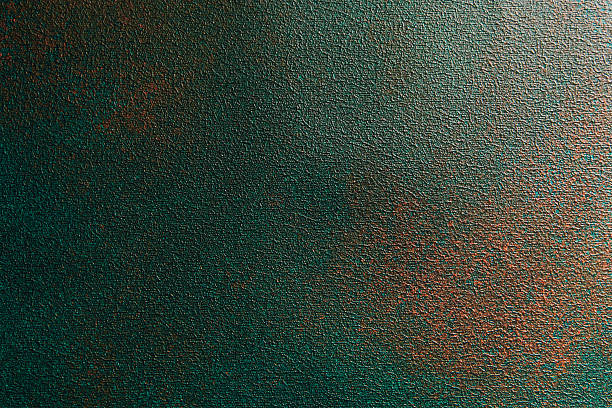 Artistic texture of teal and copper hues creates a rich background for design projects