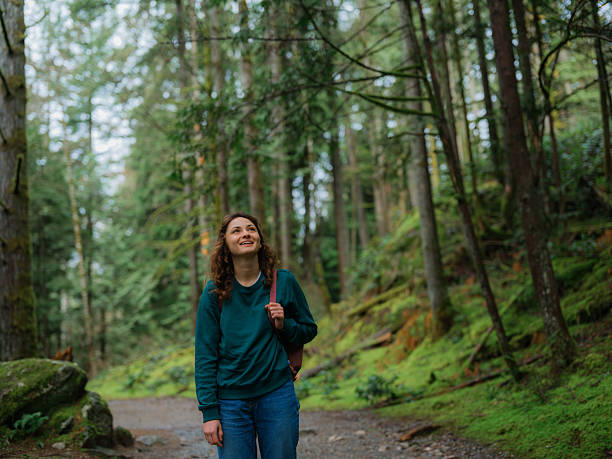 istock Woman exploring serene forest in Vancouver, Canada in summer 2218001976
