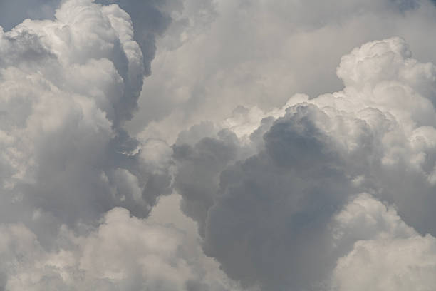 istock Blue sky with fluffy white close up clouds. 2218002229