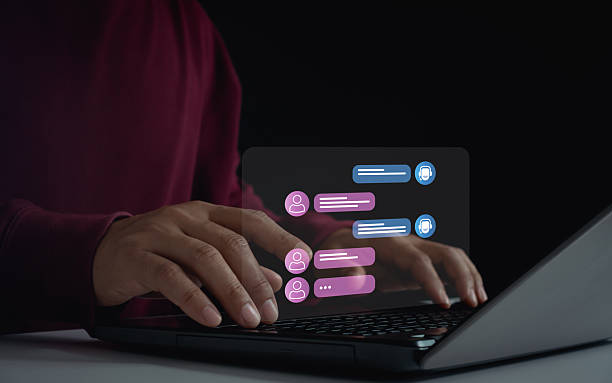 istock Person use online customer service live chatting to get support with chat bot conversation assistant automatic answering machine. Artificial intelligence, CRM software, AI agent automation technology. 2218007423