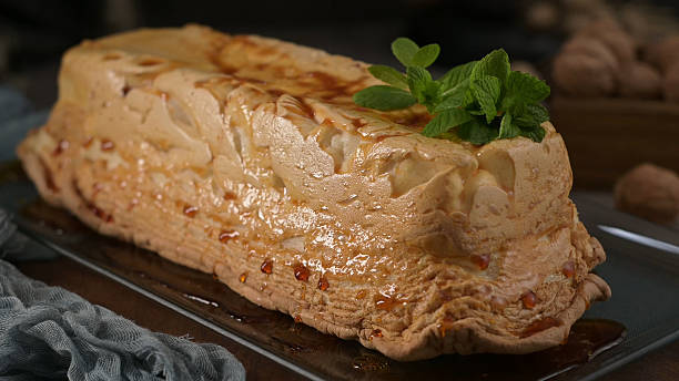 istock An elegant molotov dessert, featuring a perfectly caramelized meringue crust and a delicate mint garnish 2218012683