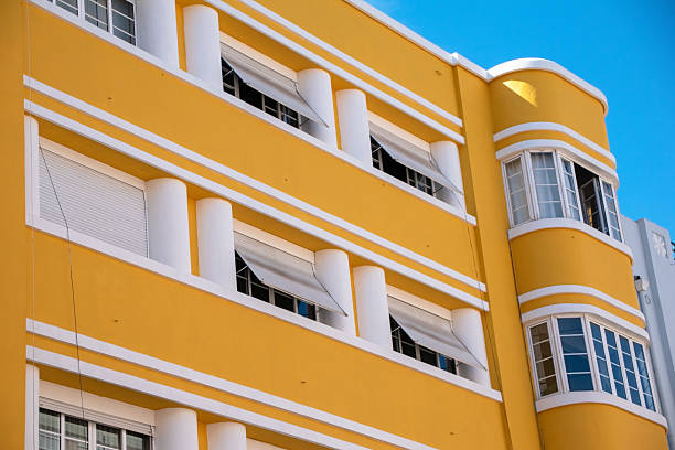 istock Art Deco Architecture with Yellow Facade and White Accents 2218016049