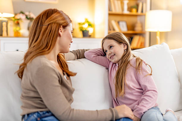 istock Mother and Daughter Sharing a Bonding Moment on a Cozy Sofa 2218017461
