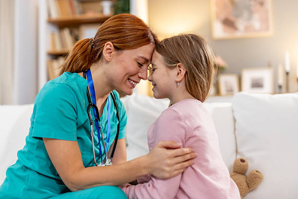 istock Nurse Caring for a Young Child in a Supportive Home Environment 2218017463