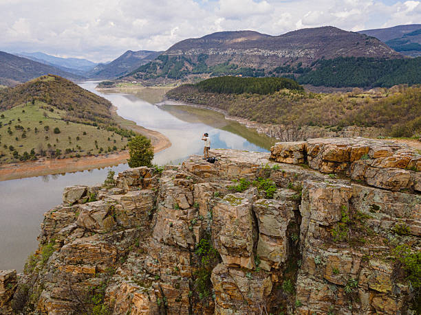 istock Explorer Birdwatching From Scenic Viewpoint. Hobbies & Eco Tourism 2218017513