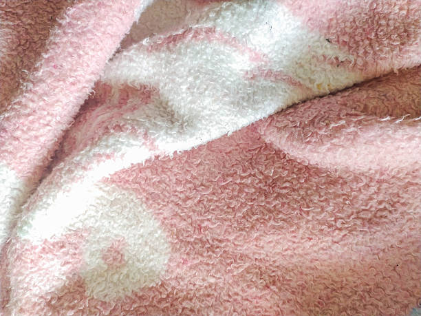istock Soft, textured background featuring a pink and white patterned fabric. Evokes comfort and warmth. Ideal for designs needing a gentle, cozy feel. 2218017841
