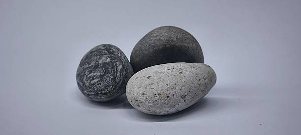 istock Natural river stones on white background 2218028926