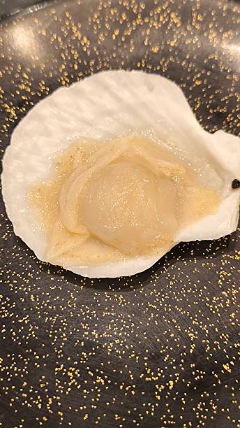 istock Scallops on a black plate. Natural food. 2218029826