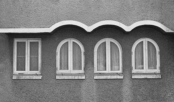 istock Four white wooden windows rough wall. Some of them shape difference but same object and Different but not divided. Old structure or building, Exterior design and vintage in monochrome style. 2218034347
