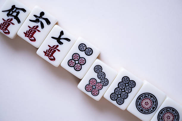 istock Mahjong tiles lined up on a white background 2218038680