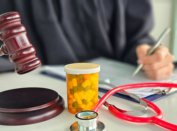 istock Legal evaluates medication case with stethoscope and gavel in office during work hours 2218039571