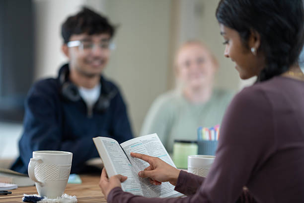 istock Group of Friends Engaged in Thoughtful Bible Study Discussion Together 2218042251