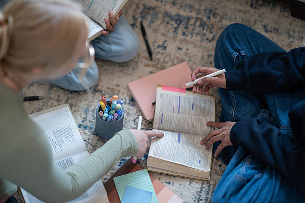 istock Two Individuals Studying the Bible Together with Notes and Highlighters 2218042277