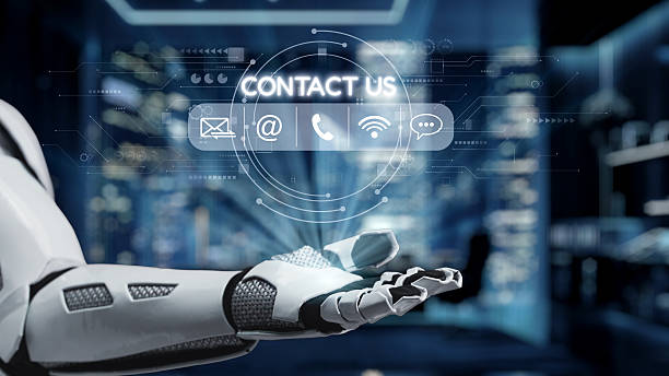 istock Futuristic Robot Hand Reaching Out with Digital Interface Symbols for Contact Information in a High-Tech Environment. Auvana 2218042785